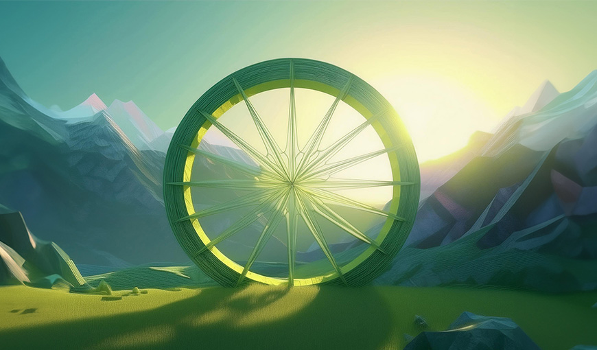 A wagon wheel with the sun setting behind it