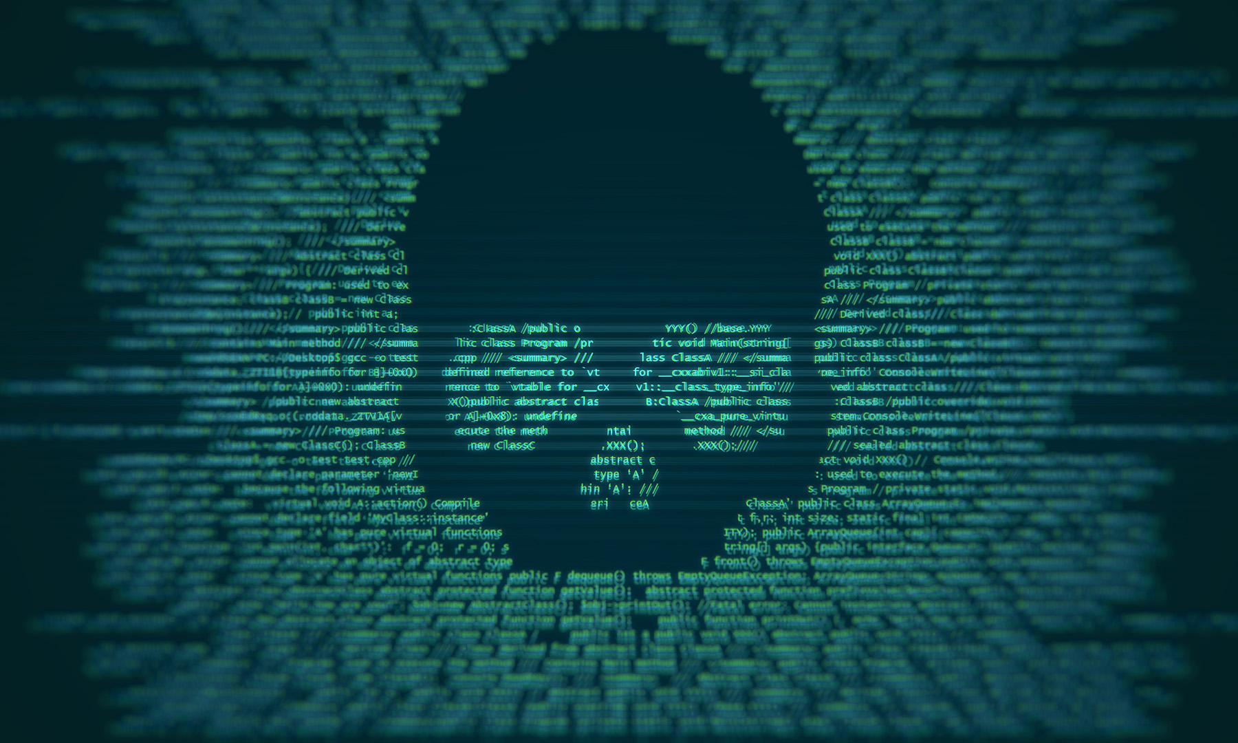 A threatening skull embedded into code on a cimputer screen.
