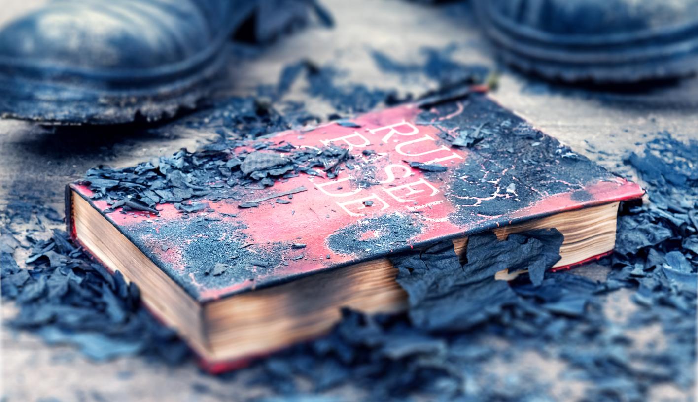 A burned book titled "Rules based Order"