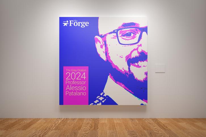 Professor Patalano portrait on a cover design hanging in a gallery