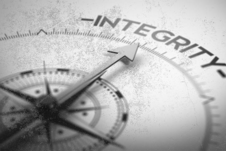 Vintage style compas pointing to integrity