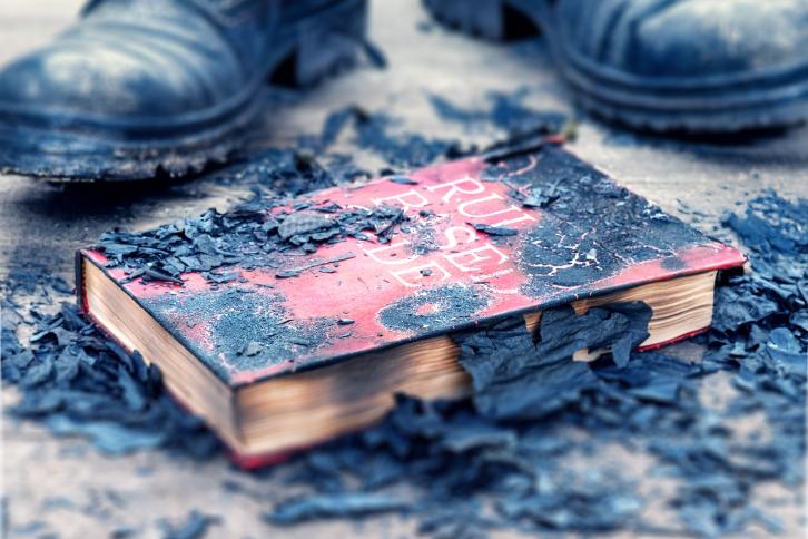 A burned book titled "Rules based Order"