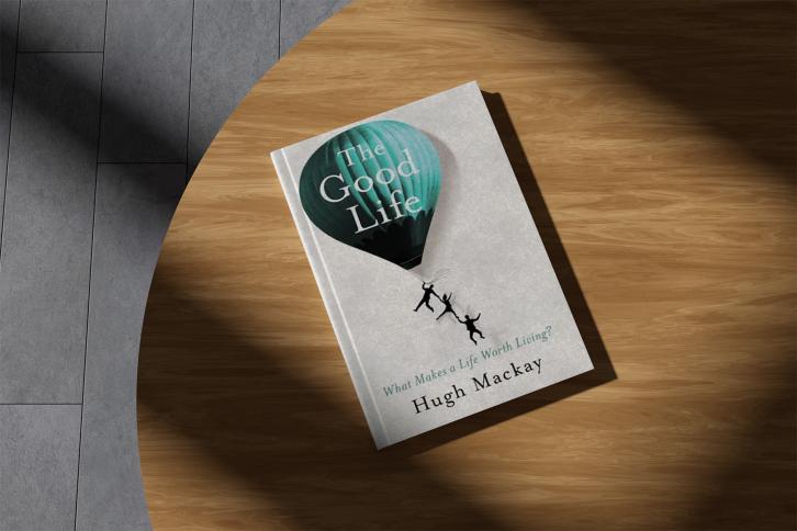 The Cover of the The Good Life, a person holding onto a hot air balloon