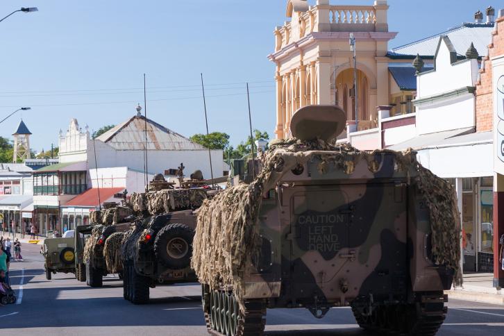 Anzac Day parade showing armoured vehicles