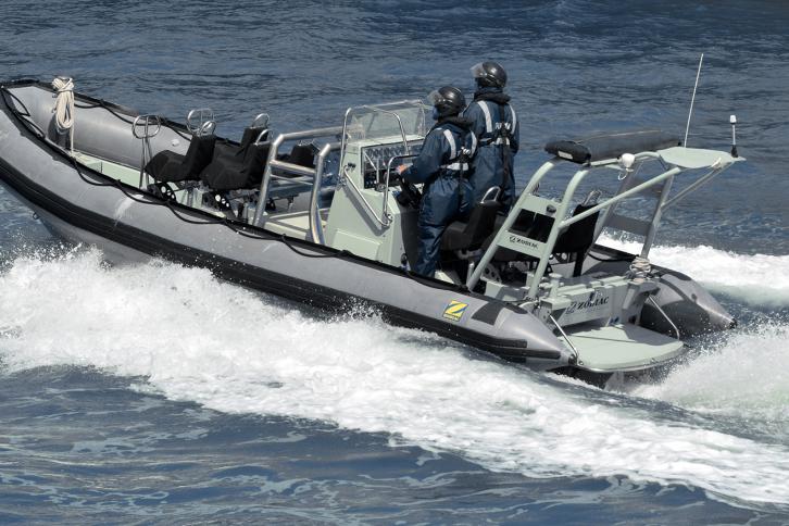 Royal New Zealand navy sailors ride a Zodiak Rigid-hulled inflat