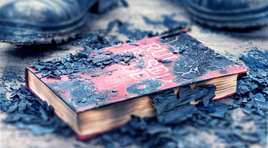 A burned book titled "Rules based Order"