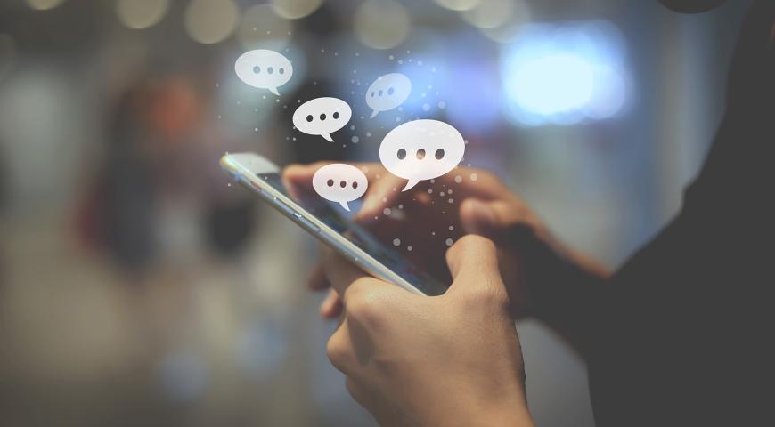 A person entering a comment on a mobile device.