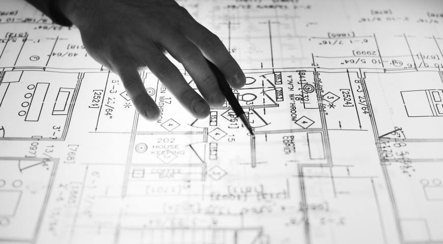 A person pondering over a map