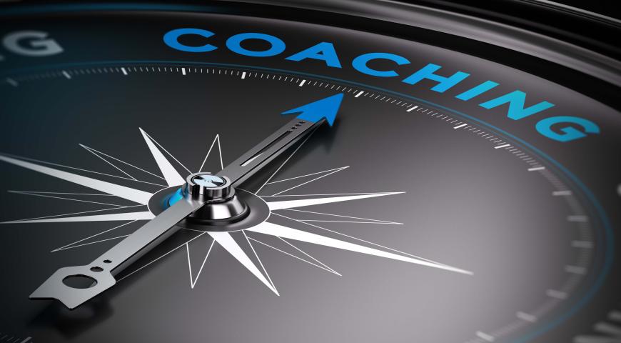 Compass arrow pointing to the word coaching