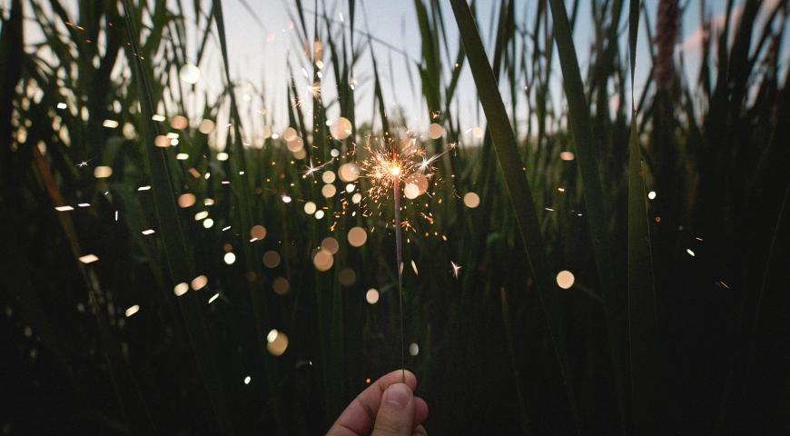 Hand holding a sparkler 