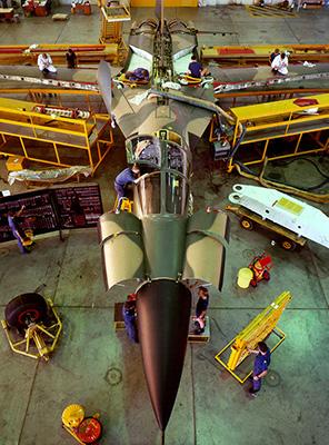 High angle, looking down on an F-111 being serviced