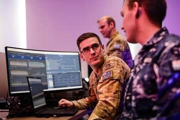 Military personnel at a computer